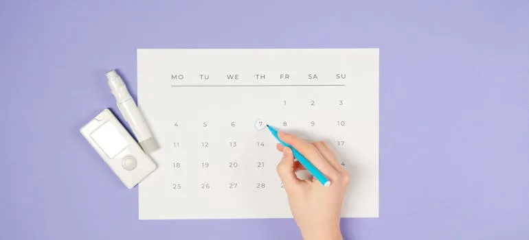A person using a calendar