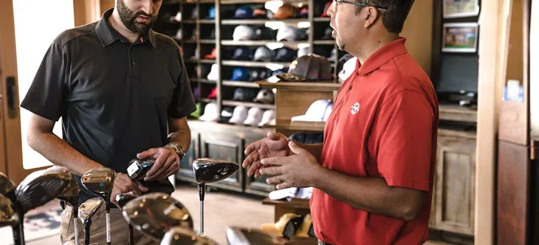 Two men in the store talking about job opportunities in Rockville