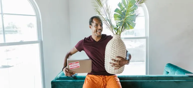 A mover holding a moving box