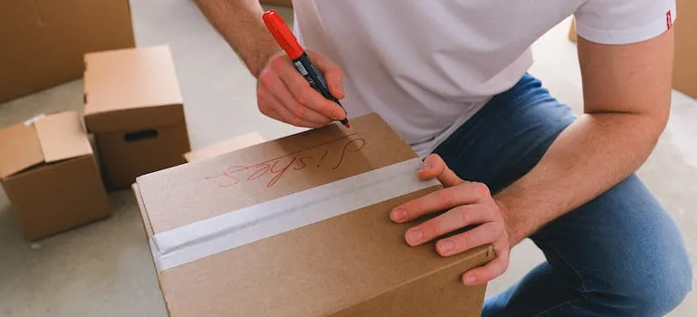 A man packing for relocating from Gaithersburg to Baltimore