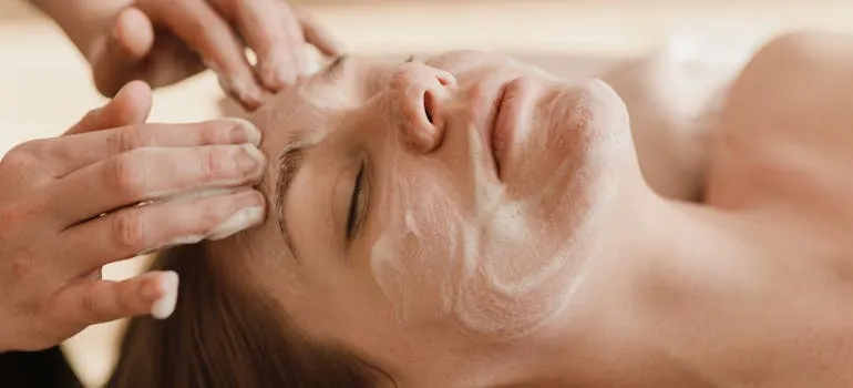 A woman getting a facial treatment