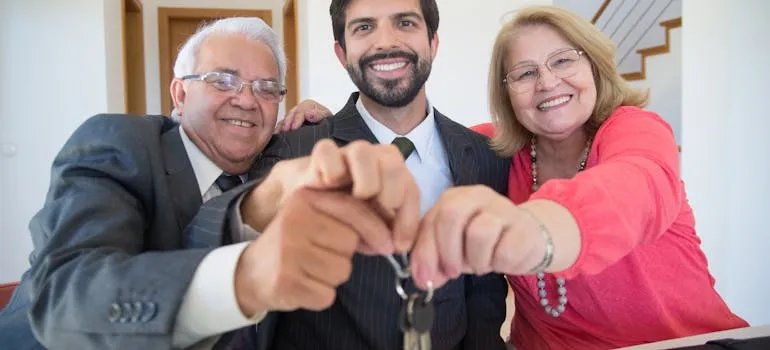 A senior couple holdinh=g house keys