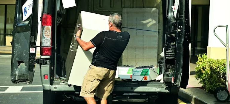 A person loading a moving truck for relocating from Rockville to Gaithersburg
