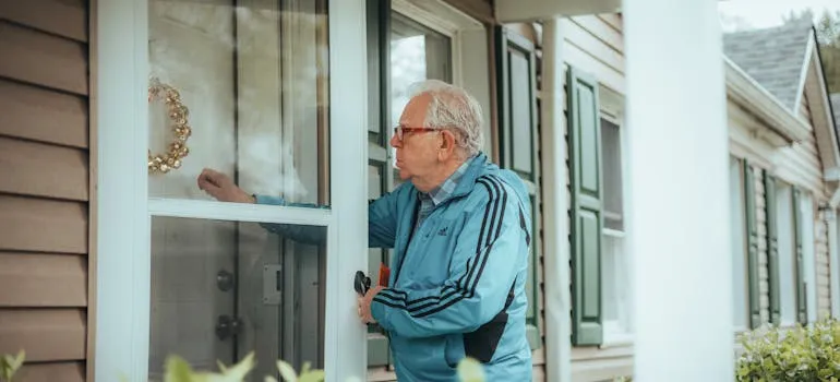 A man entering home after relocating from DC to NYC as a senior