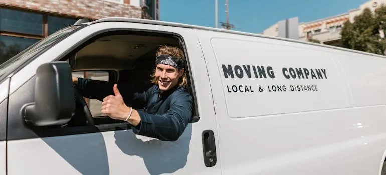 A mover in the van helping with moving out of Rockville
