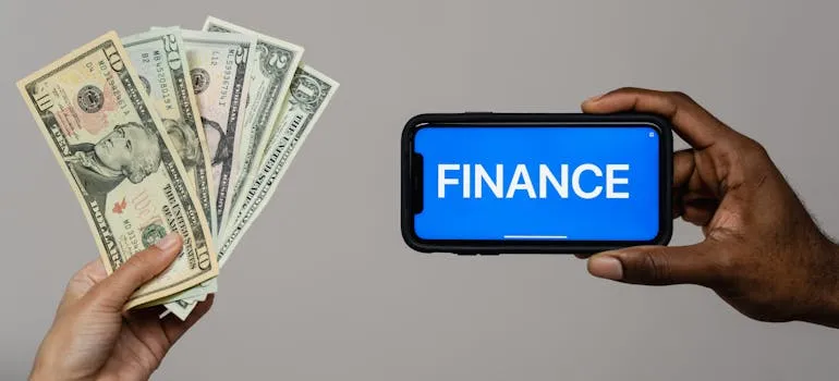Dollar bills and finance writen on the phone