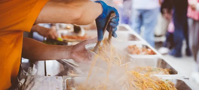 A person preparing food at one of the festivals and events in Washington DC
