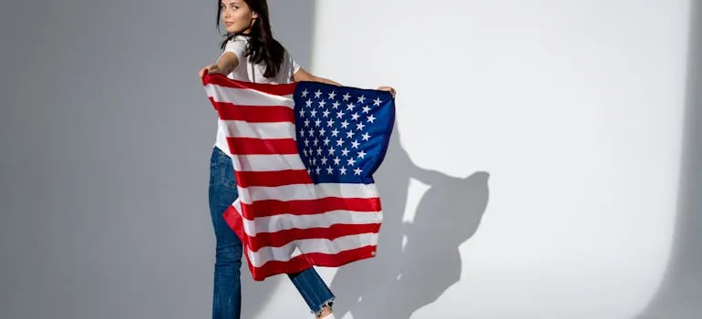A woman holding an American flag