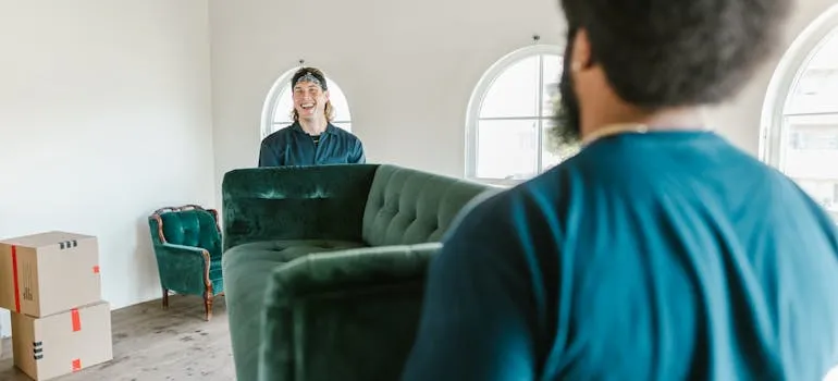 Movers relocating a sofa from Maryland to Texas