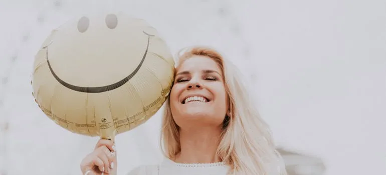 A happy woman with a balloon