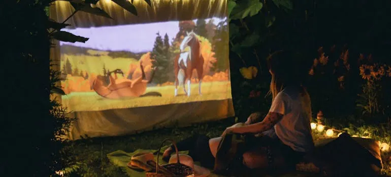 A couple watching a movie outdoors