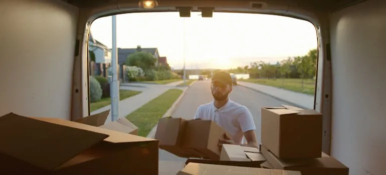 One of the Brunswick movers loading a van