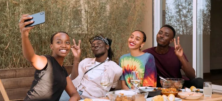 A group of friends talking about the Miami social survival guide