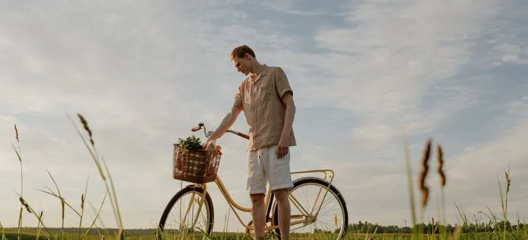 A man next to the bicycle