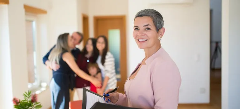 A family and a real estate agent