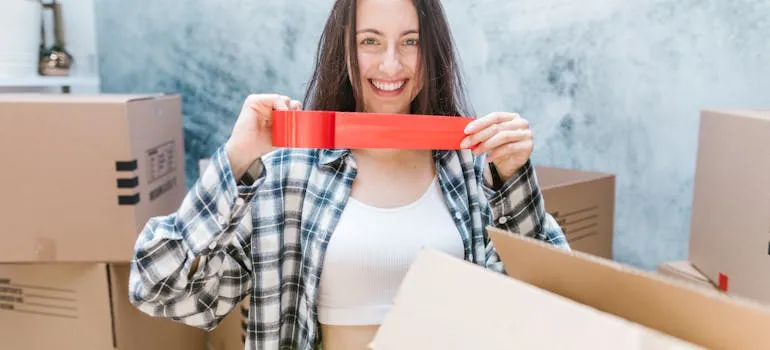 A woman using a sealing tape