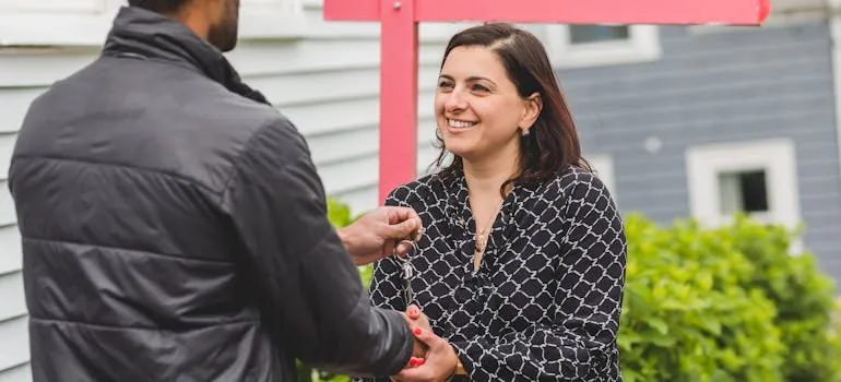 A woman buying a house in one of the Virginia cities for first time homebuyers