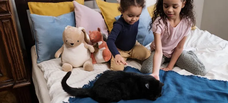 Two kids with a pet
