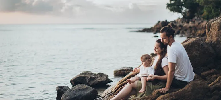 A family on the beach in one of the cities in Virginia for families moving from out of state