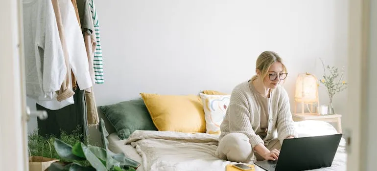 A woman working from home in one of the places to live in the DMV for remote workers