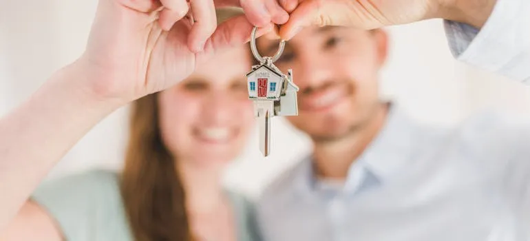 Happy couple holding house key
