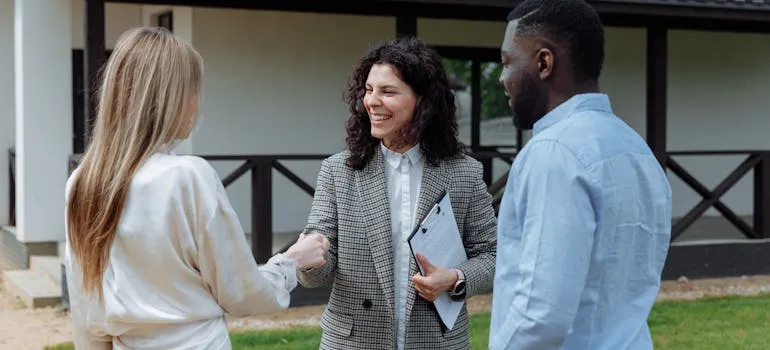 A couple with the real estate agent buying property in Pennsylvania