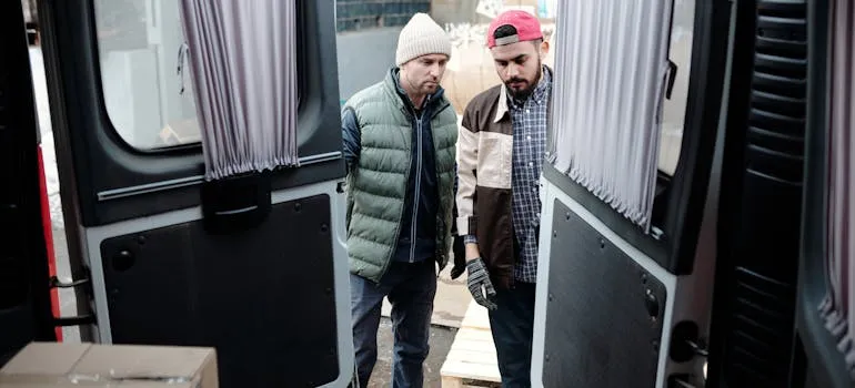 Two movers Annapolis MD loading a moving van