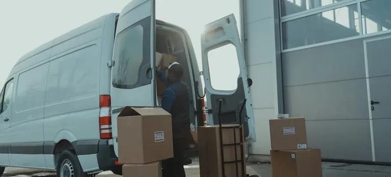 Representative of one of the moving companies Bel Air MD loading a van