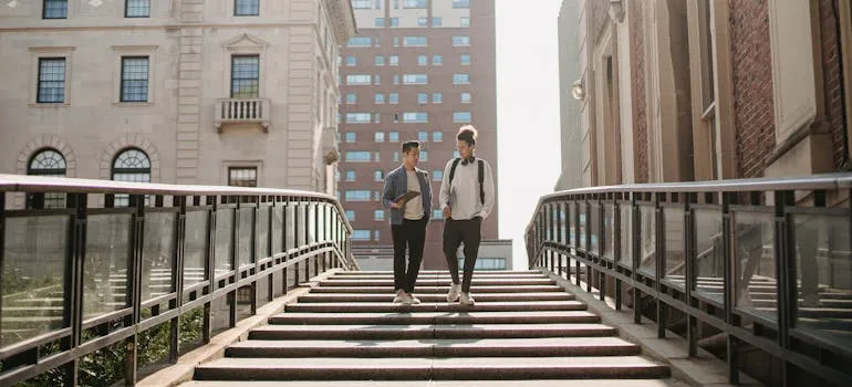 Two people talking about how to find reliable long distance moving services in Maryland