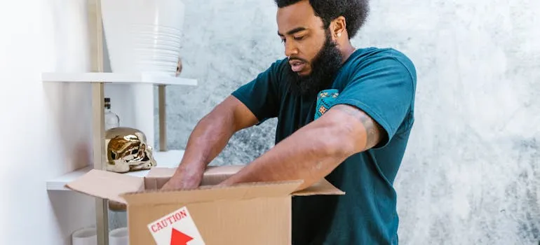 A mover packing belongings