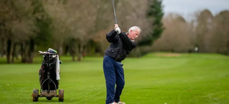 A senior playing golf 