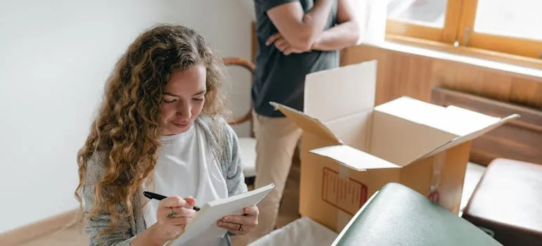 A couple packing for a move from Maryland to Delaware in 30 days