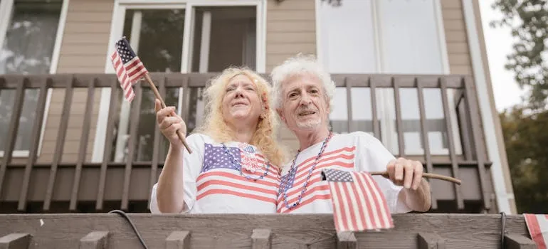 Senior couple in front of the house talking about why Marylanders are choosing to retire in Florida