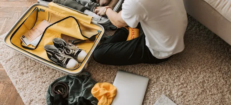 A person packing and trying to move efficiently in one day