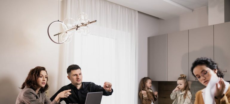 A family talking with the real estate agent about DC vs Miami for families