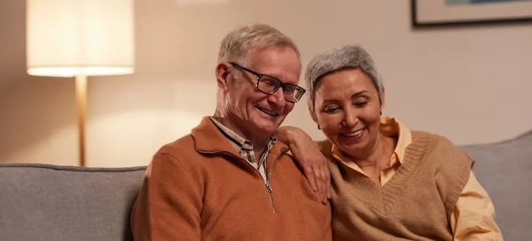 A senior couple using a laptop