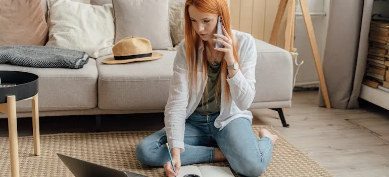 A woman using laptop to plan first 30 days in LA
