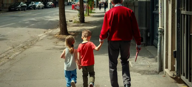 A man on the street after relocating from Baltimore to Gaithersburg with kids