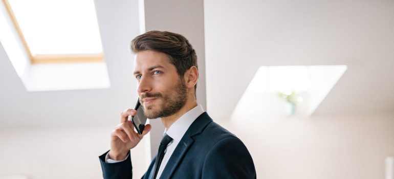 A man talking on the phone about DC vs Miami for families