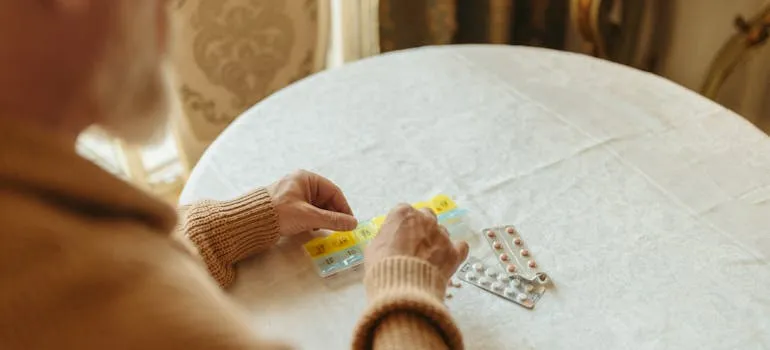 A senior holding medications