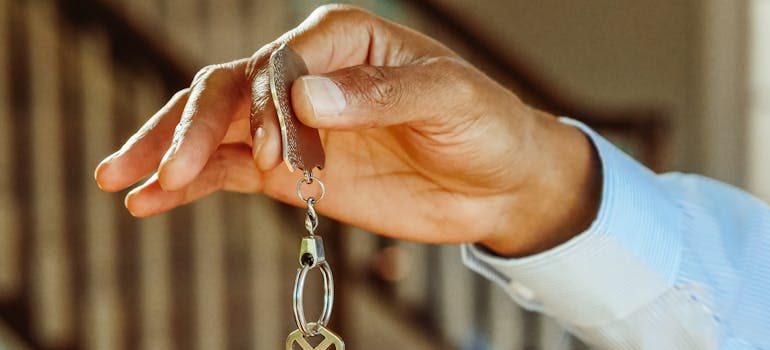 A person holding keys