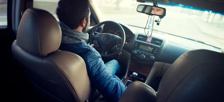 A person driving a car