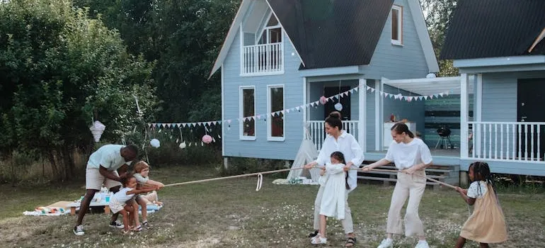 A family in front of the house