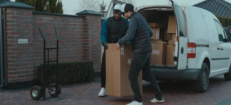 Movers loading a van 