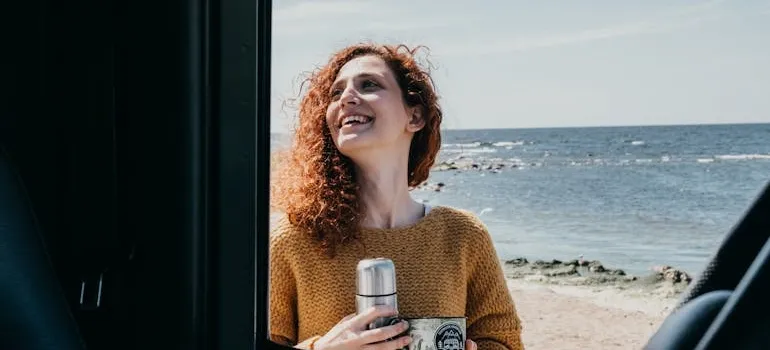 A woman enjoying a weekend road trip from Maryland to Delaware