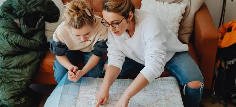Two women planning a weekend road trip from Maryland to Delaware