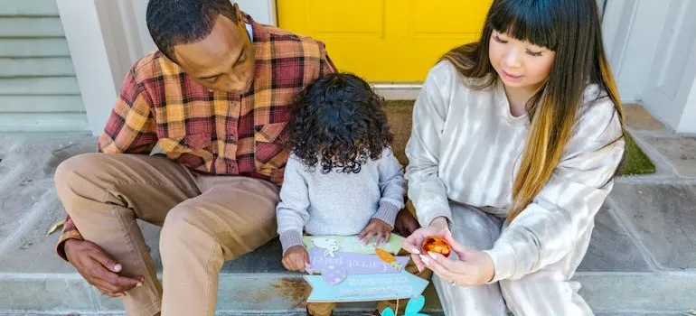 A family with the basket of Easter eggs