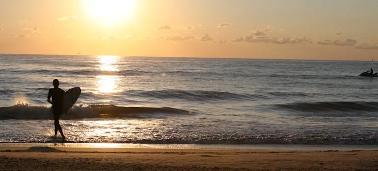 A person on the beach enjoying one of the things to do in Virginia after you move