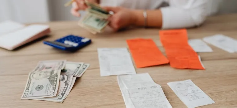 A person calculating the cost of living before before moving to Florida