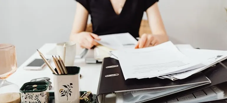 A woman preparing documentation before moving to Florida